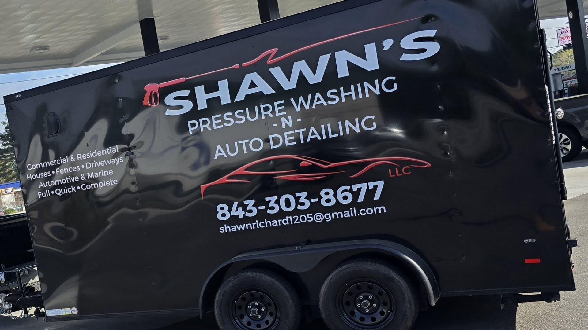 Shawn's Pressure Washing and Auto Detailing enclosed trailer, lettered with the phone number and service list