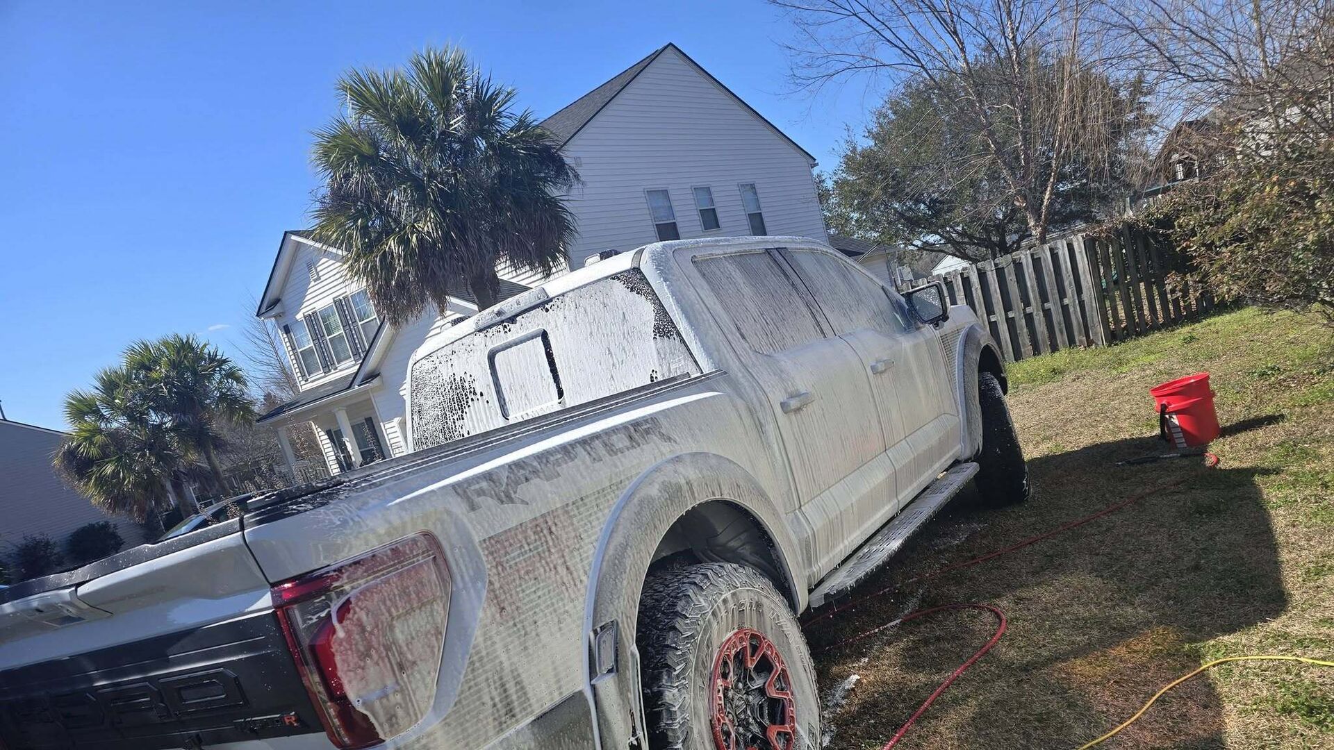 Pickup truck covered in foam during an exterior wash