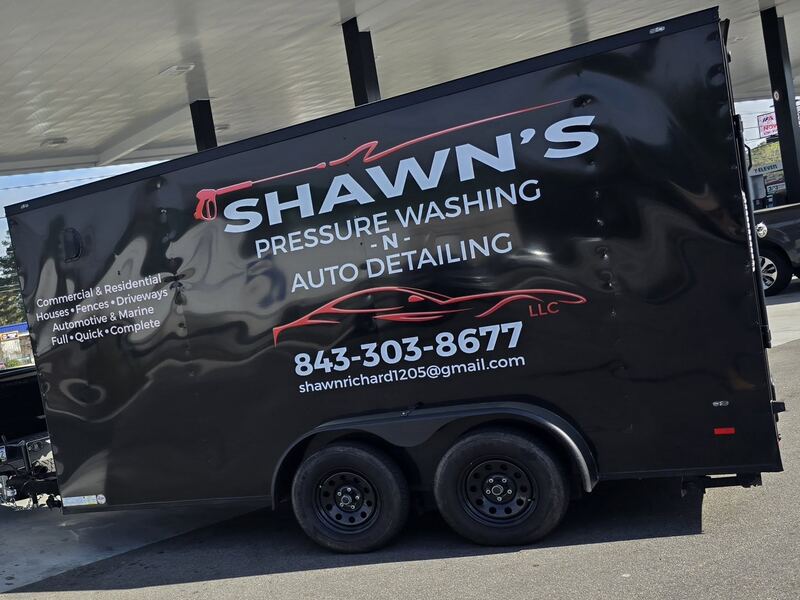The trailer, loaded and lettered with the business name